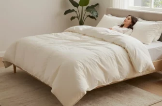 A serene bedroom scene featuring a person lying on a plush, luxurious weighted blanket, with soft ambient lighting, a cozy rug, and a small decorative plant. The blanket should be visibly heavy, with subtle texture and a subtle sheen, evoking relaxation and comfort.
