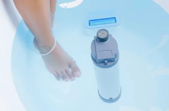 A person stepping into a clear, cold plunge pool with visible water treatment equipment such as a filtration system and UV light, surrounded by a serene, clean environment that emphasizes the concept of cold water treatment
