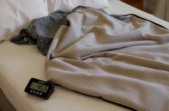 A photorealistic image of a weighted blanket draped over a neatly made bed, with a small digital scale beside it indicating the blanket's weight, showcasing the blanket's texture and even distribution of beads, in a calm, neutral bedroom setting.