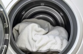 A detailed, photorealistic depiction of a washing machine interior with a Tranquility weighted blanket inside, showing the blanket's texture and the machine's interior, set in a calm, neutral environment