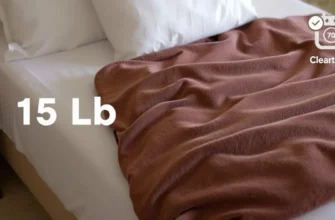 A 15 lb weighted blanket draped over a neatly made bed, with a small, realistic scale beside it showing a 15 lb weight, and a subtle cleaning icon (e.g., a washing machine symbol) in the corner to suggest care instructions. The blanket should appear plush and textured, the bed should look inviting, and the overall scene should be warm and inviting without any text or lettering.