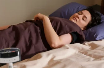 A cozy bedroom scene featuring a person lying on a weighted blanket, with a scale or a weight chart nearby, showing the blanket's weight in pounds or kilograms. The blanket should be plush, with a subtle pattern, and the room should have soft lighting.