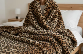 A cozy bedroom scene featuring a person wrapped in a stylish leopard print weighted blanket, soft ambient lighting, and a minimalist decor