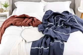 A neatly arranged queen size bed showcasing a variety of lightweight blankets in different colors and textures, with a cozy bedroom setting including soft lighting and minimalistic decor, emphasizing comfort and practicality for everyday use