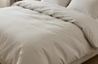 A cozy bedroom scene featuring a neatly made bed with a 60x80 weighted blanket duvet cover in a neutral tone, soft lighting, and subtle texture details highlighting the fabric's weight and comfort, no text or numbers visible
