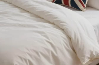 A cozy bedroom scene featuring a neatly made bed with a plush weighted blanket draped over it, soft ambient lighting, and subtle UK-themed elements like a Union Jack cushion or a cup of tea on a bedside table, illustrating comfort and relaxation as described in the guide