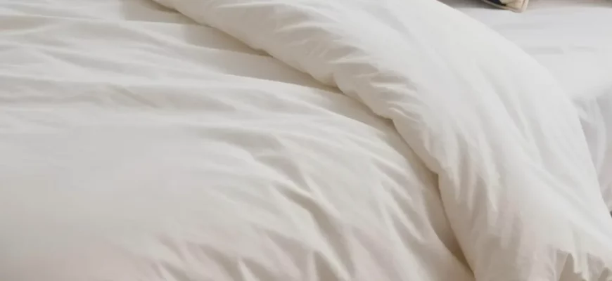 A cozy bedroom scene featuring a neatly made bed with a plush weighted blanket draped over it, soft ambient lighting, and subtle UK-themed elements like a Union Jack cushion or a cup of tea on a bedside table, illustrating comfort and relaxation as described in the guide