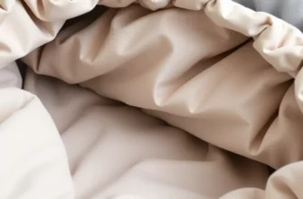 A close-up of a modern, washable weighted blanket made of soft fabric with subtle stitching, showing a clean, leak-proof interior with no visible seams or plastic components, neutral colors, minimalist design, no text or symbols
